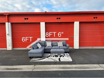 Grey sectional sofa and ottoman