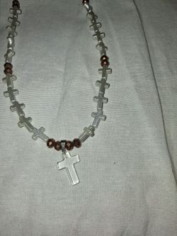 Clear cross necklace with cross beads and brown accent beads