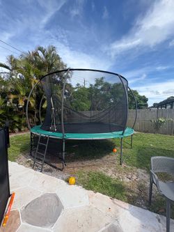Free! 14 foot trampoline with basketball hoop
