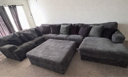 Dark gray sectional and Ottoman