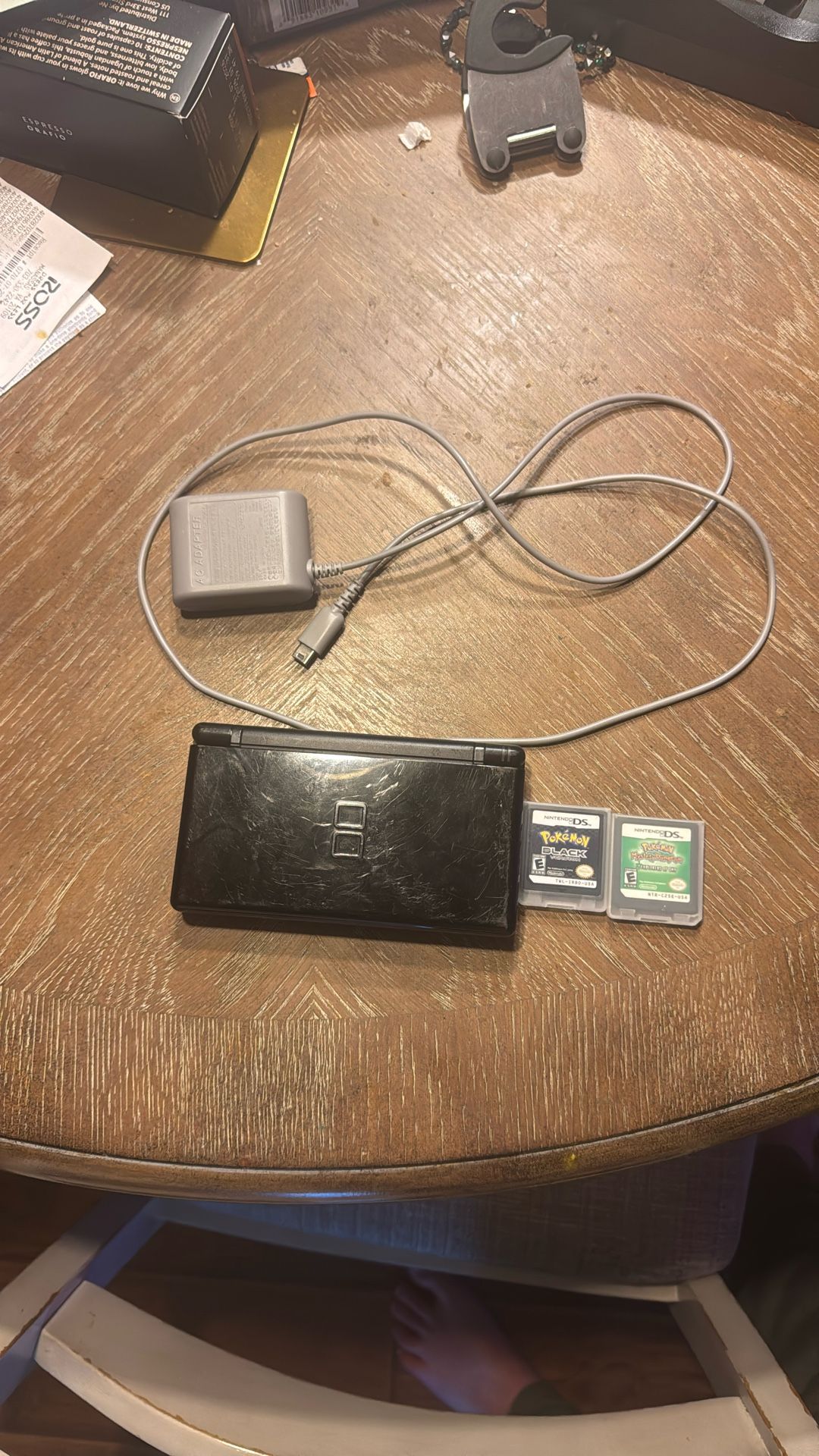 DS Lite with charger along with Pokemon Black and Pokemon Explorers Of Sky