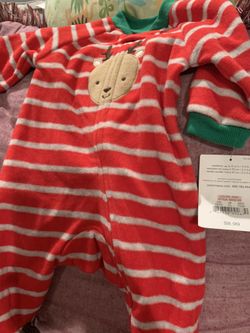 Newborn size Xmas pjs new with tags .