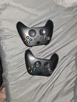 2 Carbon Black Xbox X Controllers.