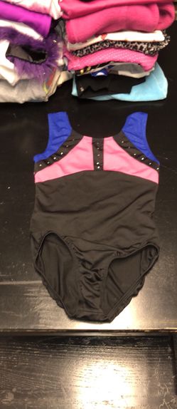 Kid’s size large gymnastics leotard with rhinestones on the front and a cut out in the back in excellent condition