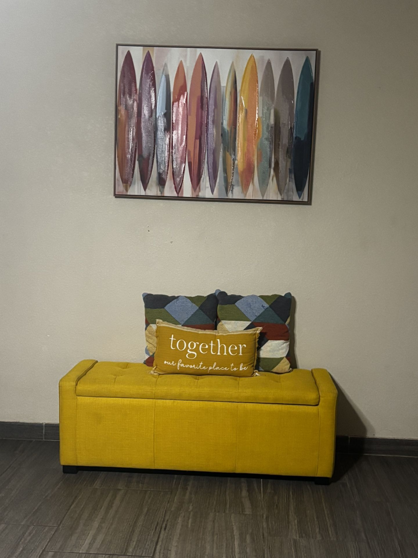 yellow tufted storage ottoman bench with frame and pillows