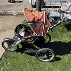 Jeep Jogging Stroller With Stationary Storage Basket And Speakers