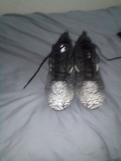 Black and white Nike cleats size 10.5