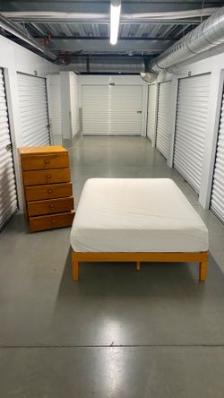 Full size bed with mattress and dresser