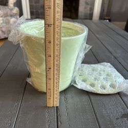 One flower arranging vase (brand new), and one Pink planter pot