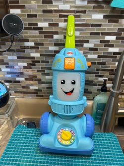 Fisher-Price Laugh & Learn Light-Up Learning Vacuum.