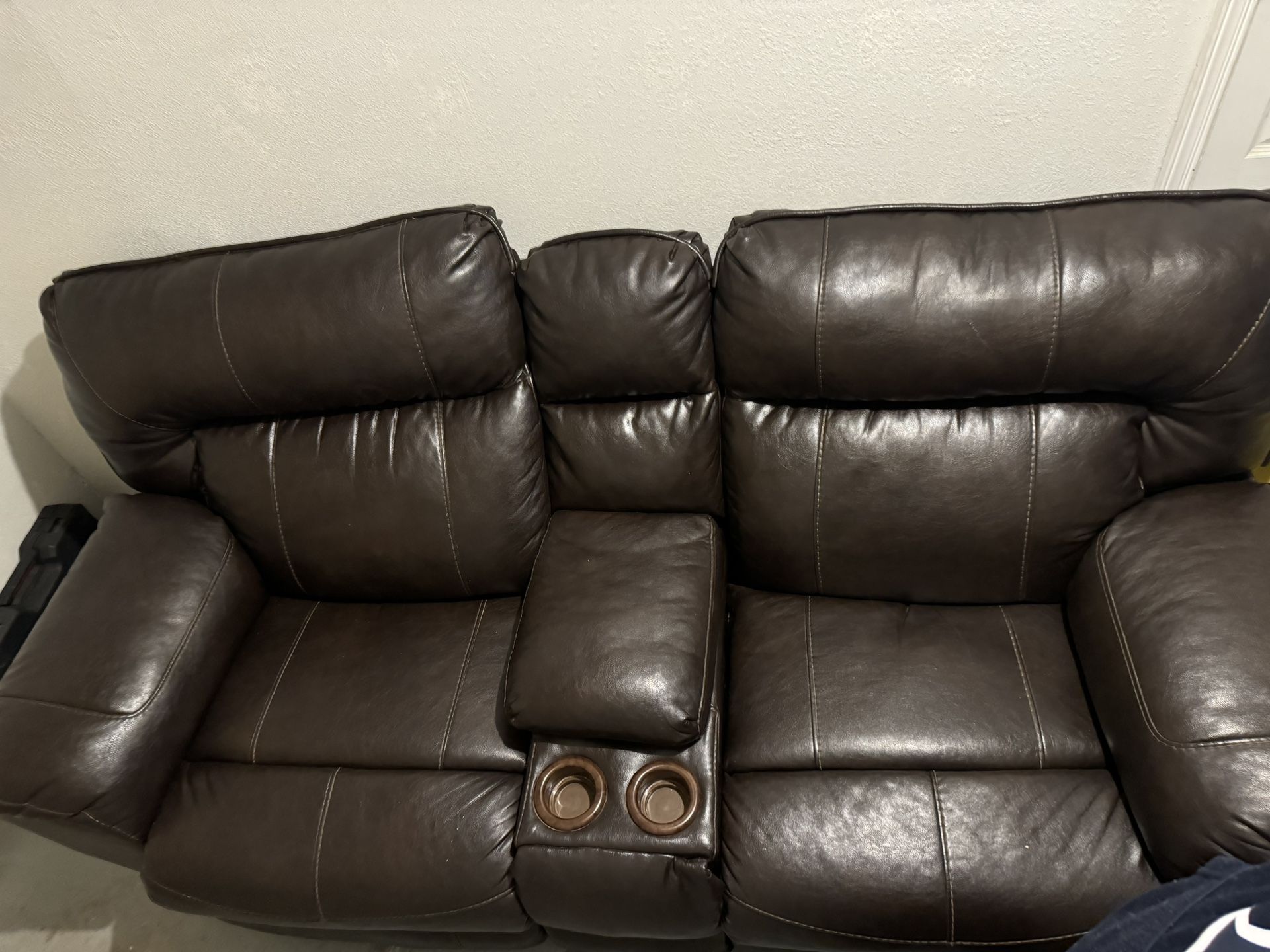 Leather sofa with recliner for 2 cup holder