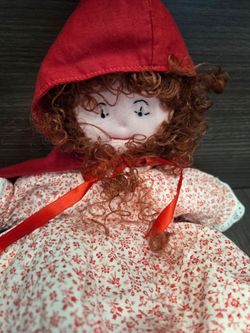 handmade,  topsy-turvy fabric doll features a reversible Little Red Riding Hood, flipped to reveal Grandma and the Wolf.