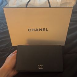 CHANEL Lambskin Camellia Embossed Yen Wallet