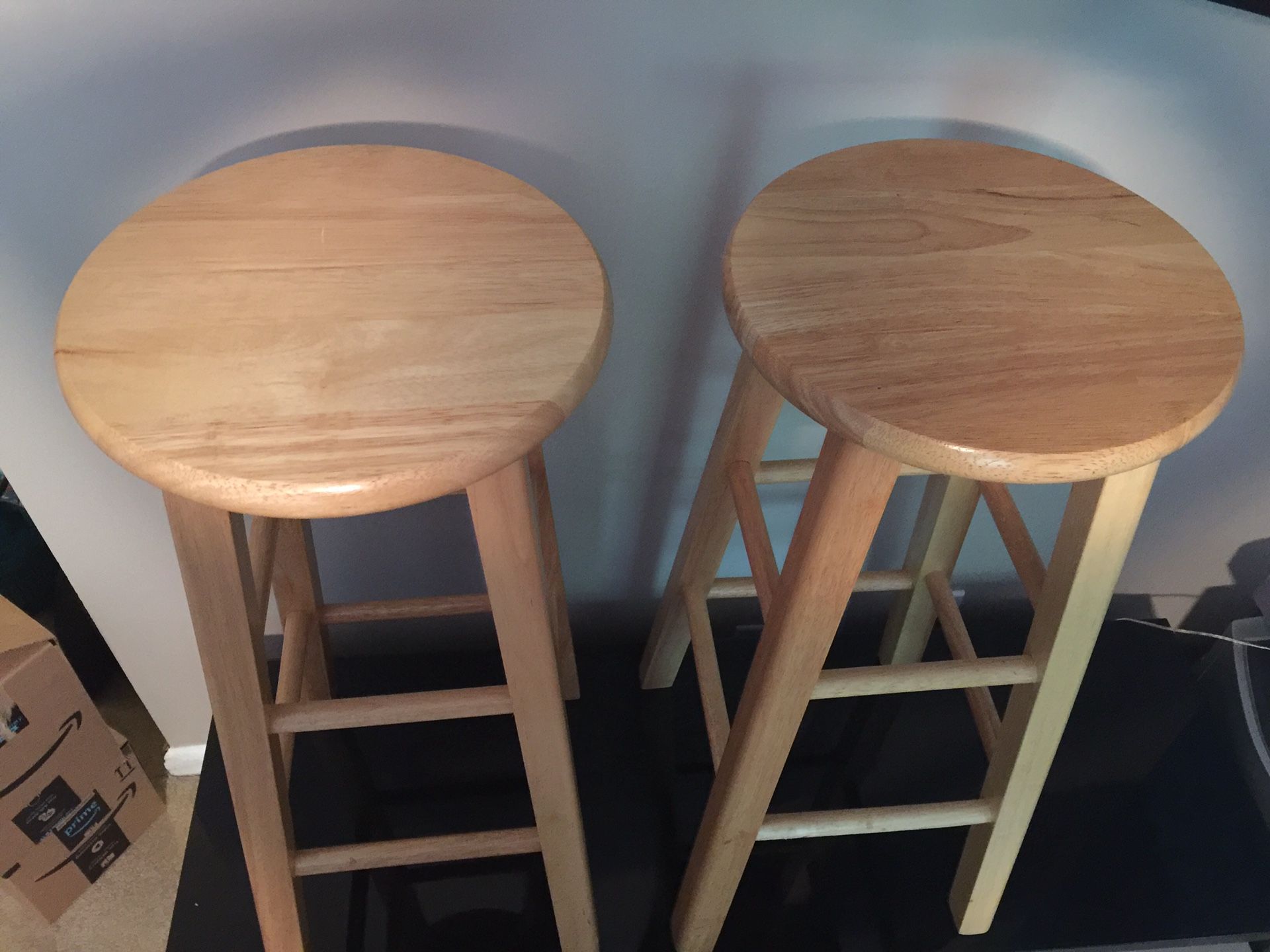 Two wooden bar stools