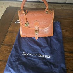 British tan leather Dooney and Bourke purse.
