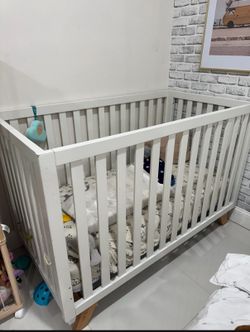White crib with mattress
