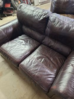 Free. Leather love seat and another one no arm on one side because it was a sectional . Area is off white lane and fambrough