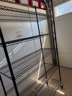 Black mesh metal rolling/locking shelves