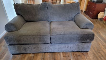 Comfy well cared for love seat couch