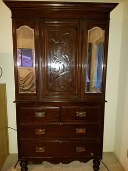 Antique cabinet with shelving and drawers