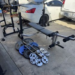 Bench press with 7ft 45lbs bar plus 250lbs of Olympic weights and tricep bar