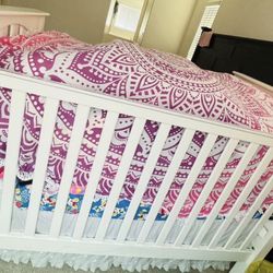 wood infant bed with mattress