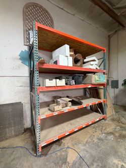 Two 109in x 42in upright racks $60 each
