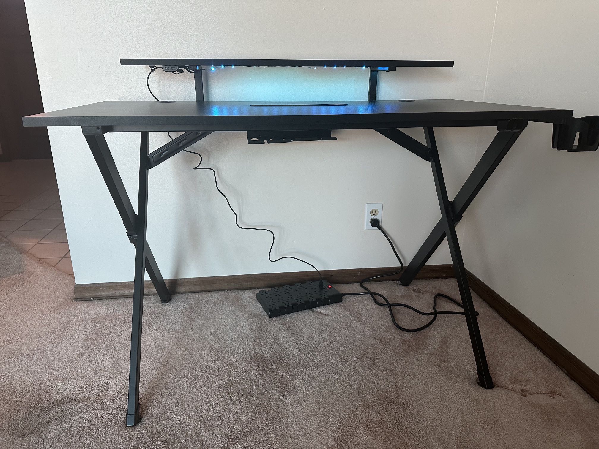 Black and carbon fiber laminate gaming desk. 