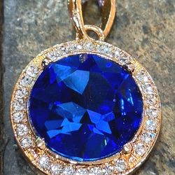 Simulated Blue Saphire pendant with white zircon stones