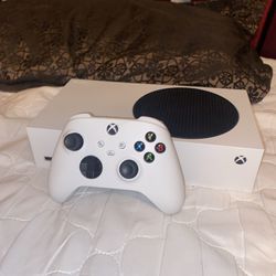 Xbox series s with games in it, HDMI court. and headphones