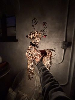 Christmas decor white light wicker reindeer with bells around the neck
