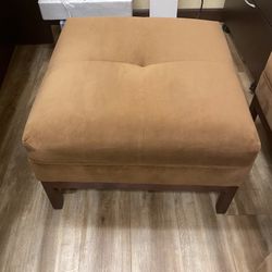 two brown velvet ottomans