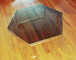Brass and smoked glass hexagonal coffee table in the style of Milo Baughman