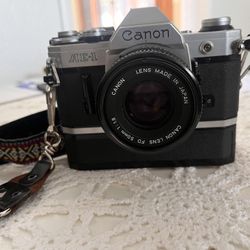 AE-1 Camera With Zoom Lens And Rewinder 