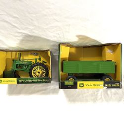 Mint Condition Still In The Box Us Made By Toy Maker ERTL Scale 1/16 Diacast Toy (John Deere) Tractor And Trailer. Retails for $110 for both.