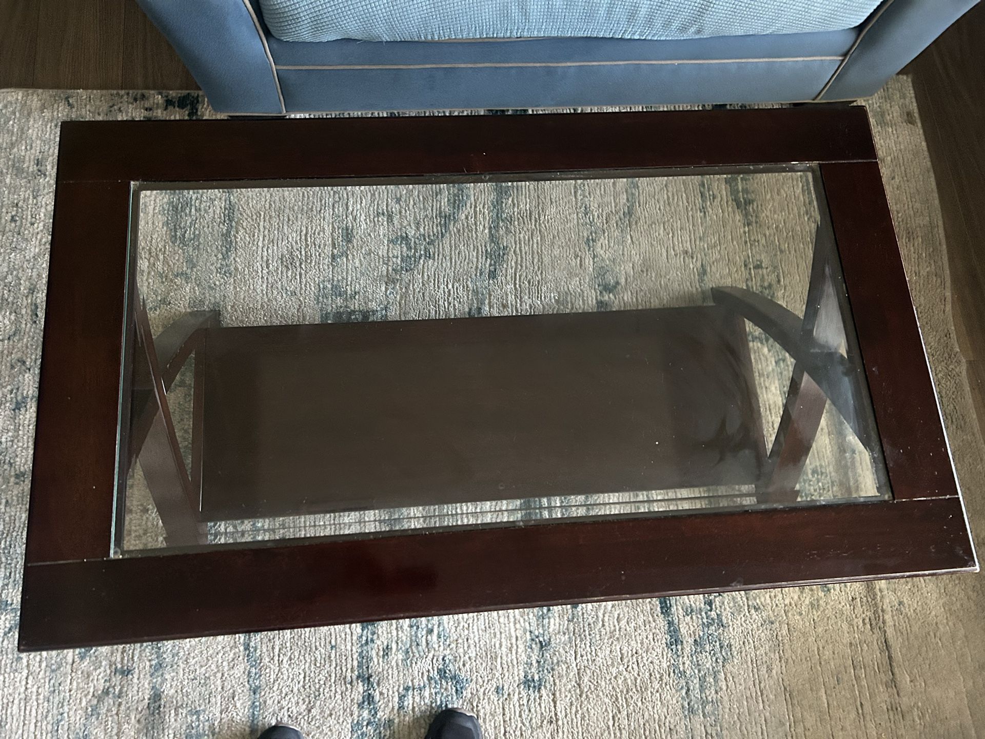 Wooden coffee table with glass top
