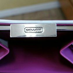 Woman's Pink Coach Wallet.