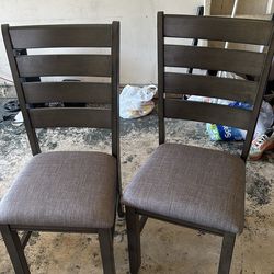 2 grey dining chairs