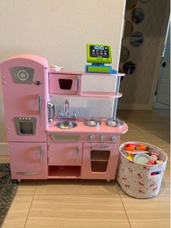 Little girls play kitchen