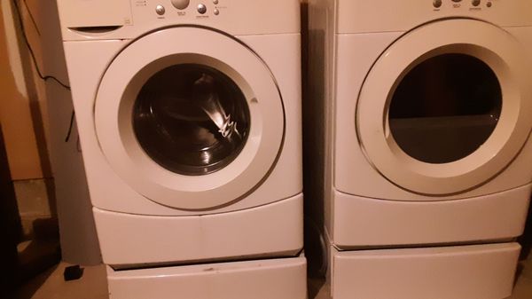 Front Load washer and dryer with stand pedestals ,great condition