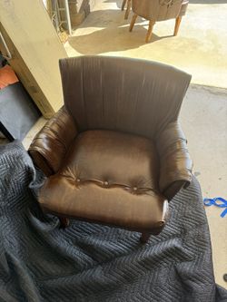 Leather Chairs: vintage brown leather club chair featuring a tufted seat