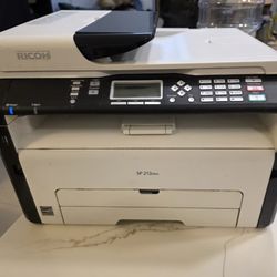 Ricoh SP-213NWF mono laser MFP printer, 23 ppm. Prints in black only. 