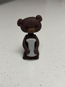Brown Bear Holding “i”