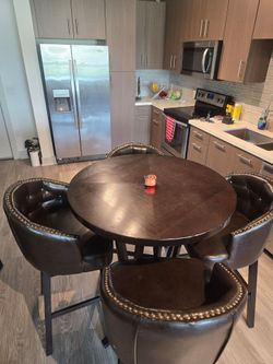 Bar height table + 4 chairs