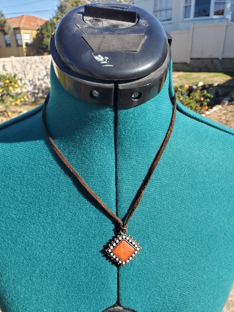 Oramge Medallion Necklace On Leather Cord