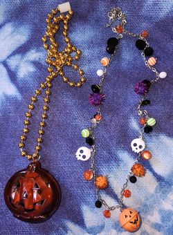 2 Halloween necklaces  1 needs batteries to light up $10 for both