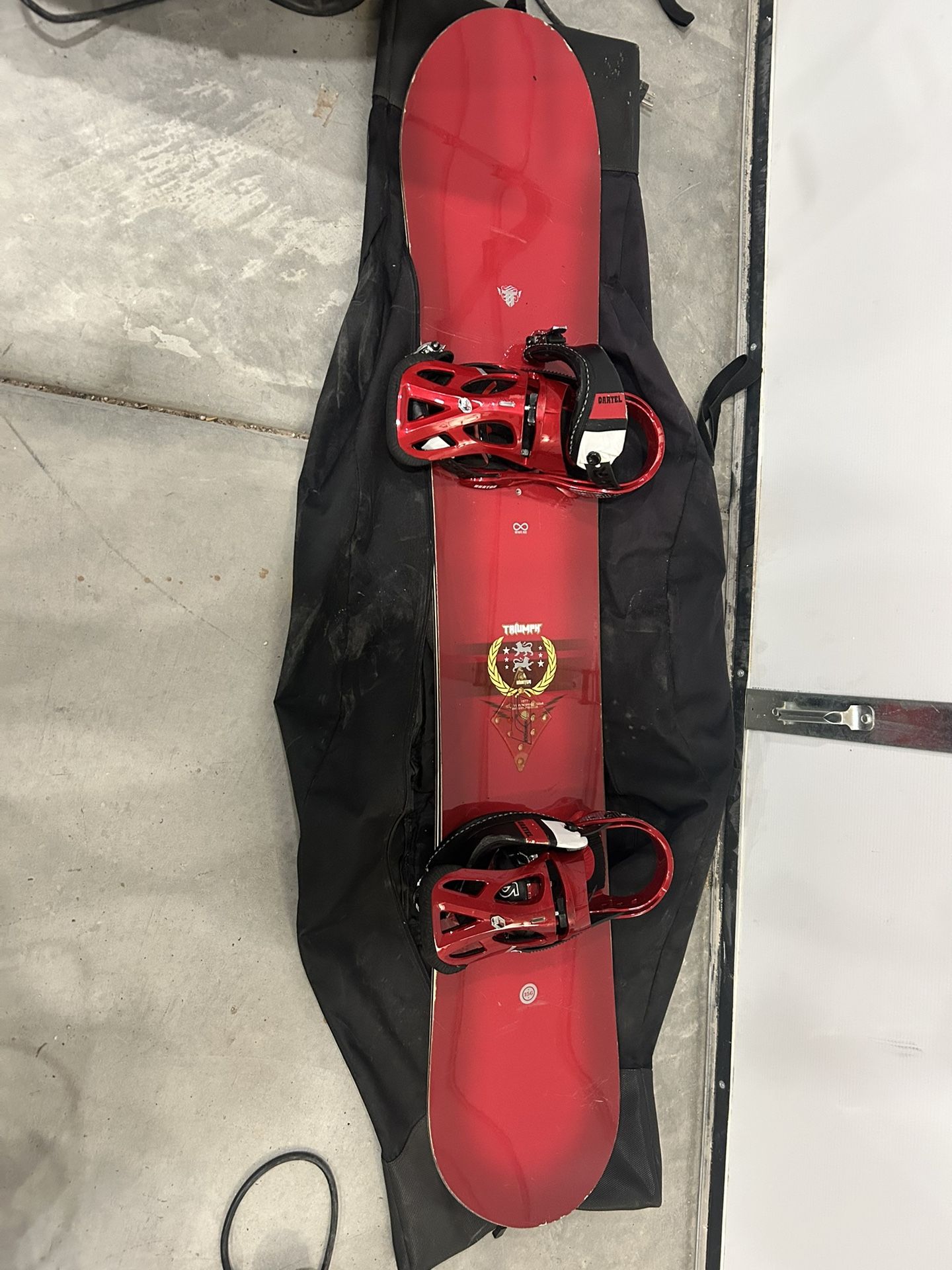Red Triumph Snowboard with Bindings