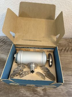 New vintage aluminum cookie and pastry press with 8 form plates and pastry tip Price is firm, cash only