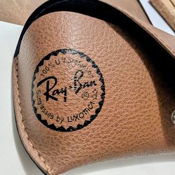 Sunglass and eyeglass cases Ray-Ban and then a pop-up trifold cork