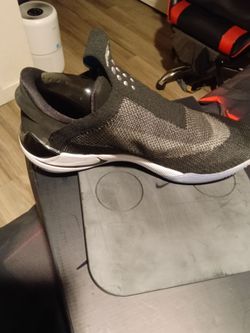 Nikes size 12 comes with charging pad never worn